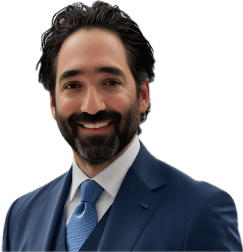 A smiling man in a blue suit and tie against a gray background.