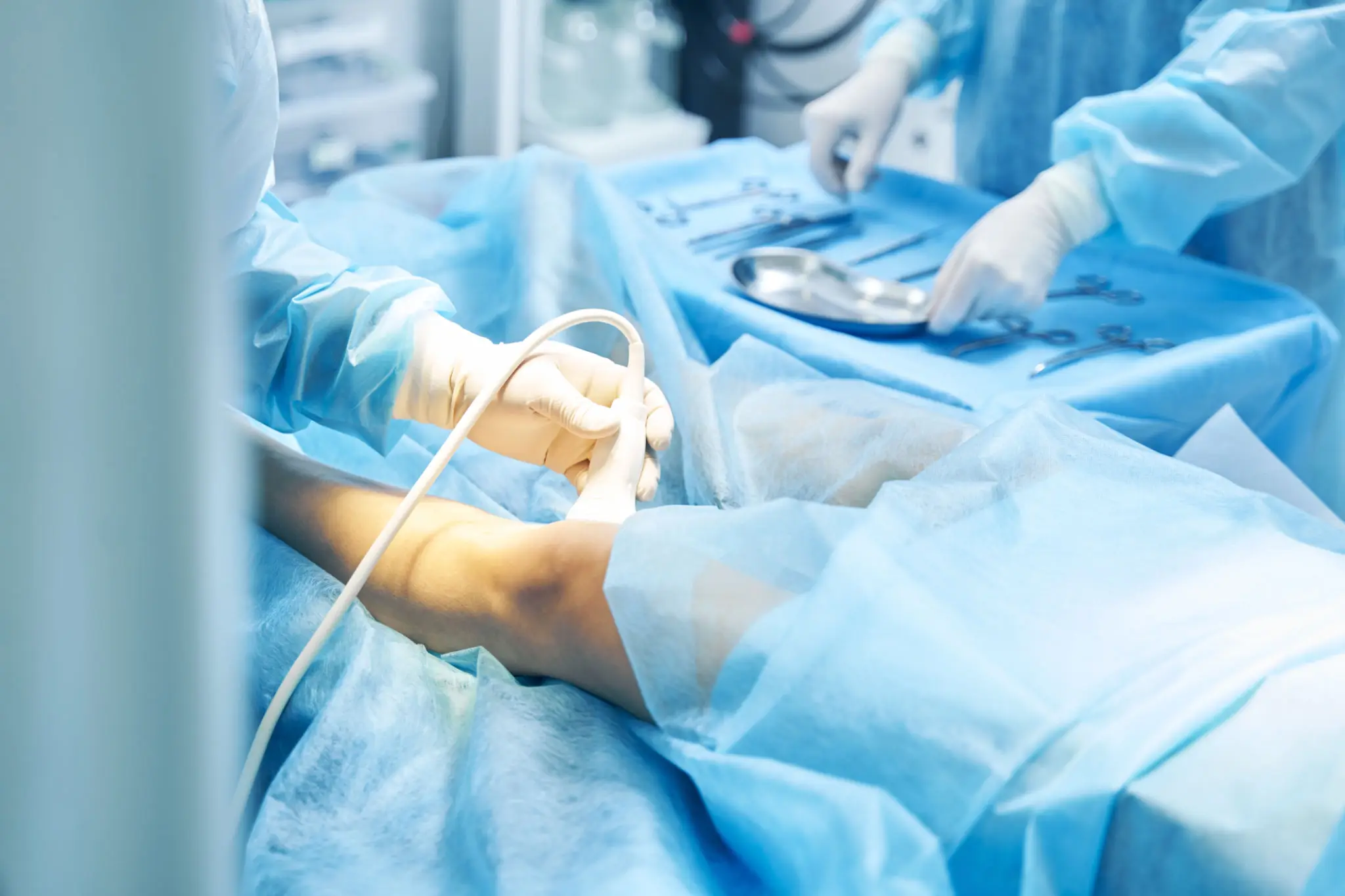 Surgeons performing a delicate operation in a sterile environment.