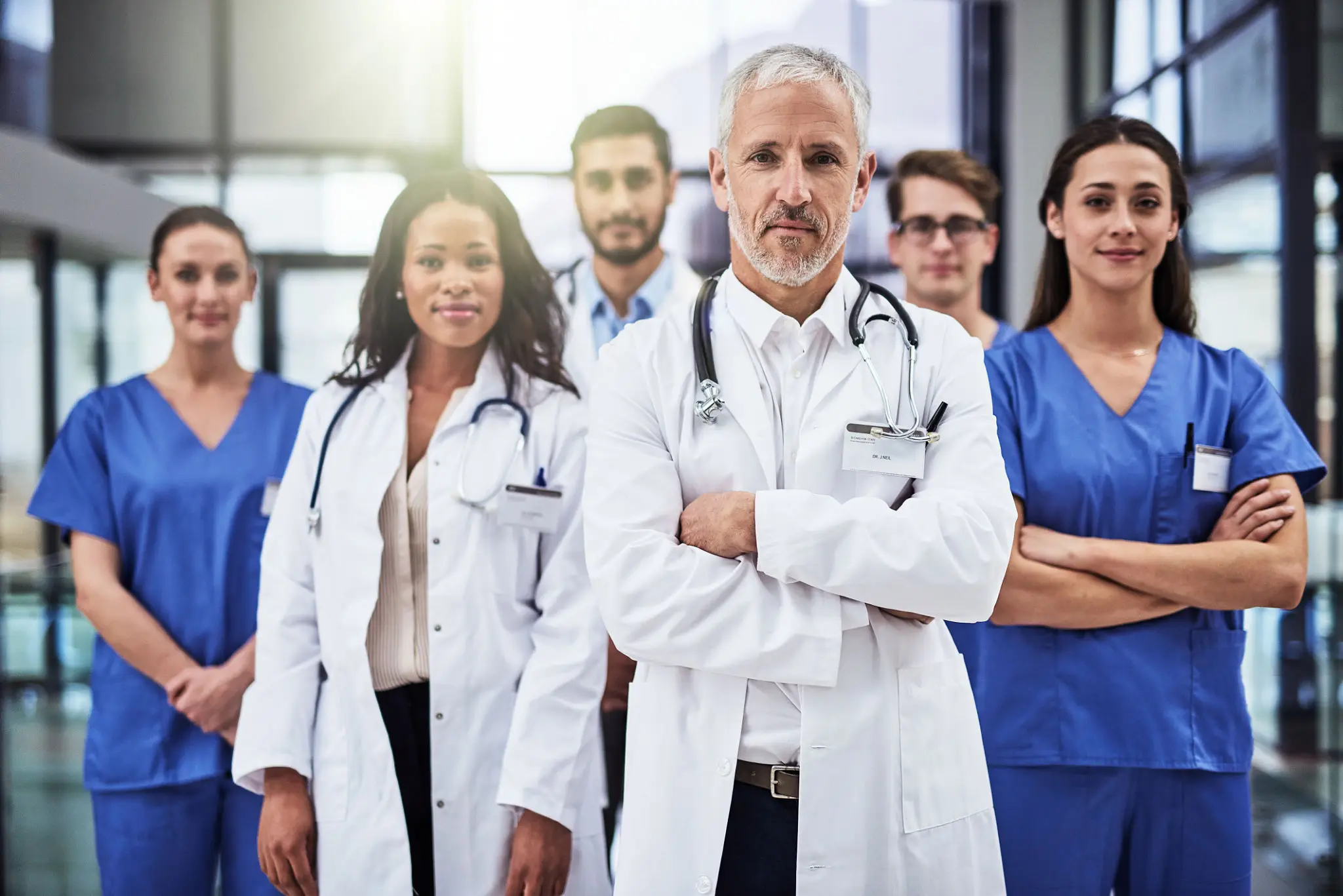 A confident medical team standing together in a hospital setting.